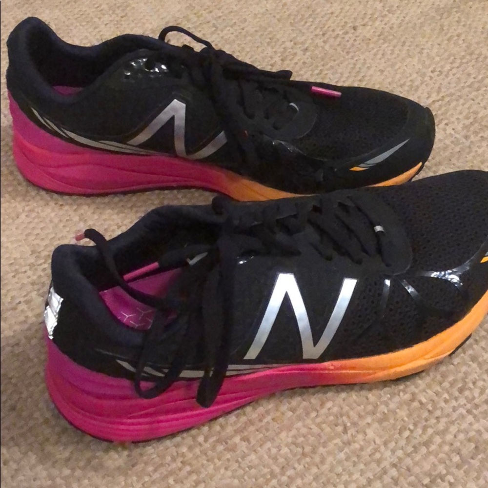 Black, pink and orange New Balance tennis shoes